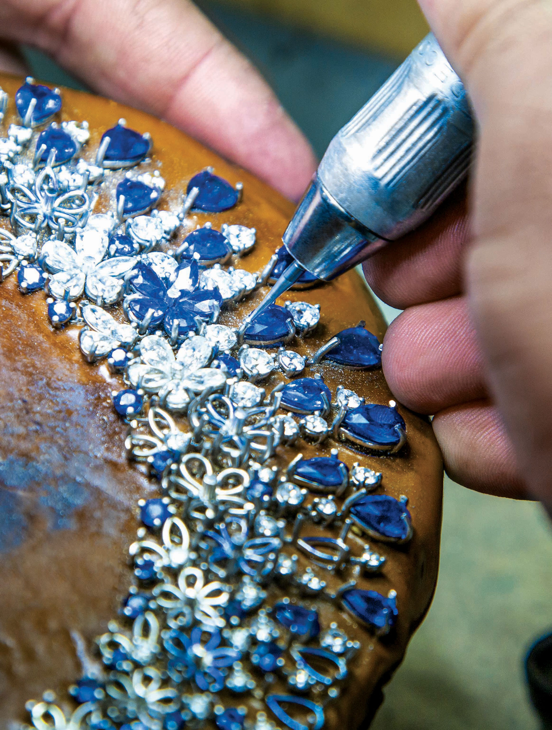 Specialist works on blue and silver diamonds